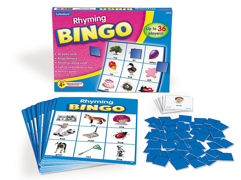 Box for Rhyming BINGO next to a pile of cardboard marking pieces, calling cards, and a BINGO card. The top BINGO card has simple images  with the matching word below including fox, mop, and sink.