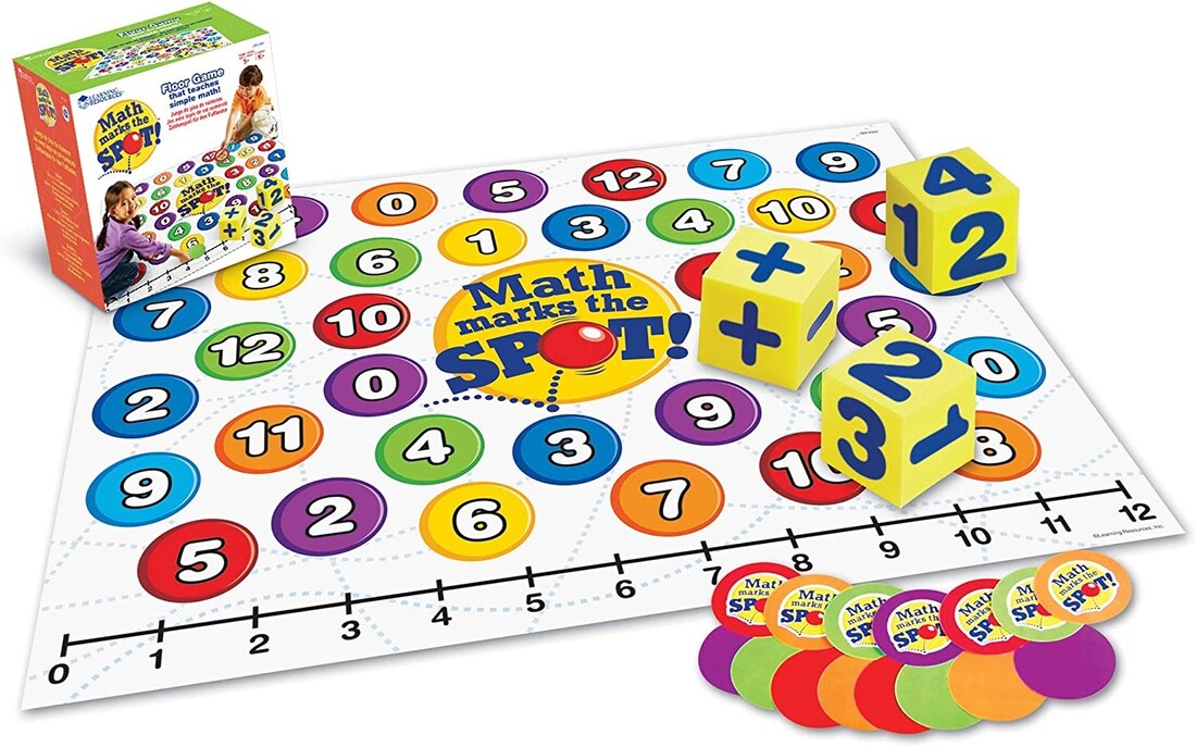 Large white mat with numbers 1 through 20 in brightly colored circles. Three large foam dice sit on the mat.
