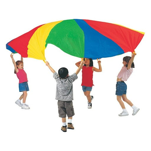 Four young children lifting a colorful parachute above their heads.