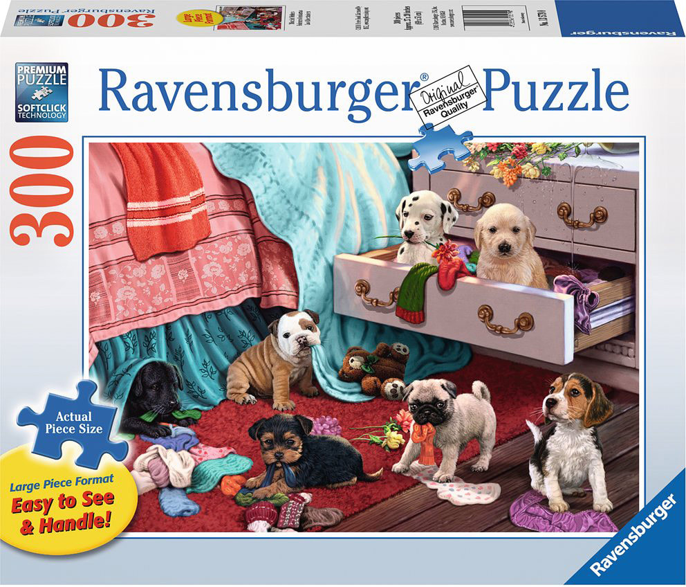 Box for 300 piece puzzle from Ravensburger depicting seven puppies in the middle of a messy bedroom.